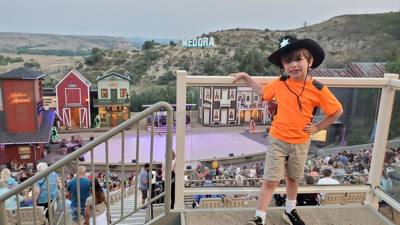 Medora Musical tonight.  Gotta love the backdrop behind all of this.  What a fantastic venue!  Avery is having fun.
