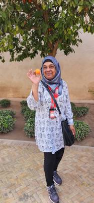 This gal was standing there minding her own business and an orange feel out of the tree and hit her in the head.  She sa